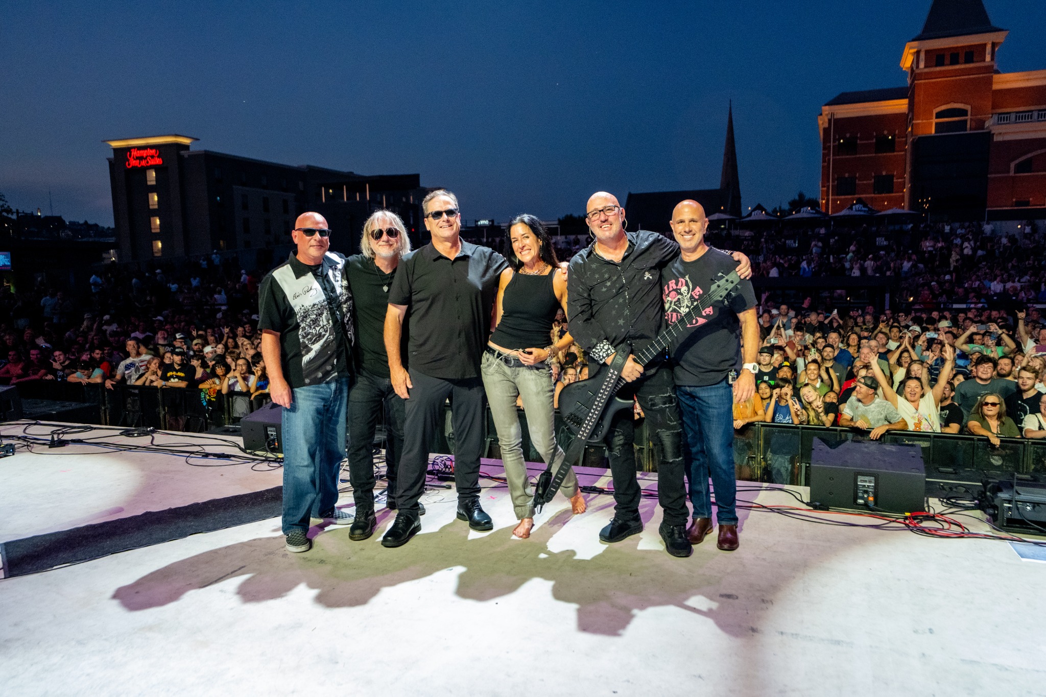 Cin City Crew group press photo on stage